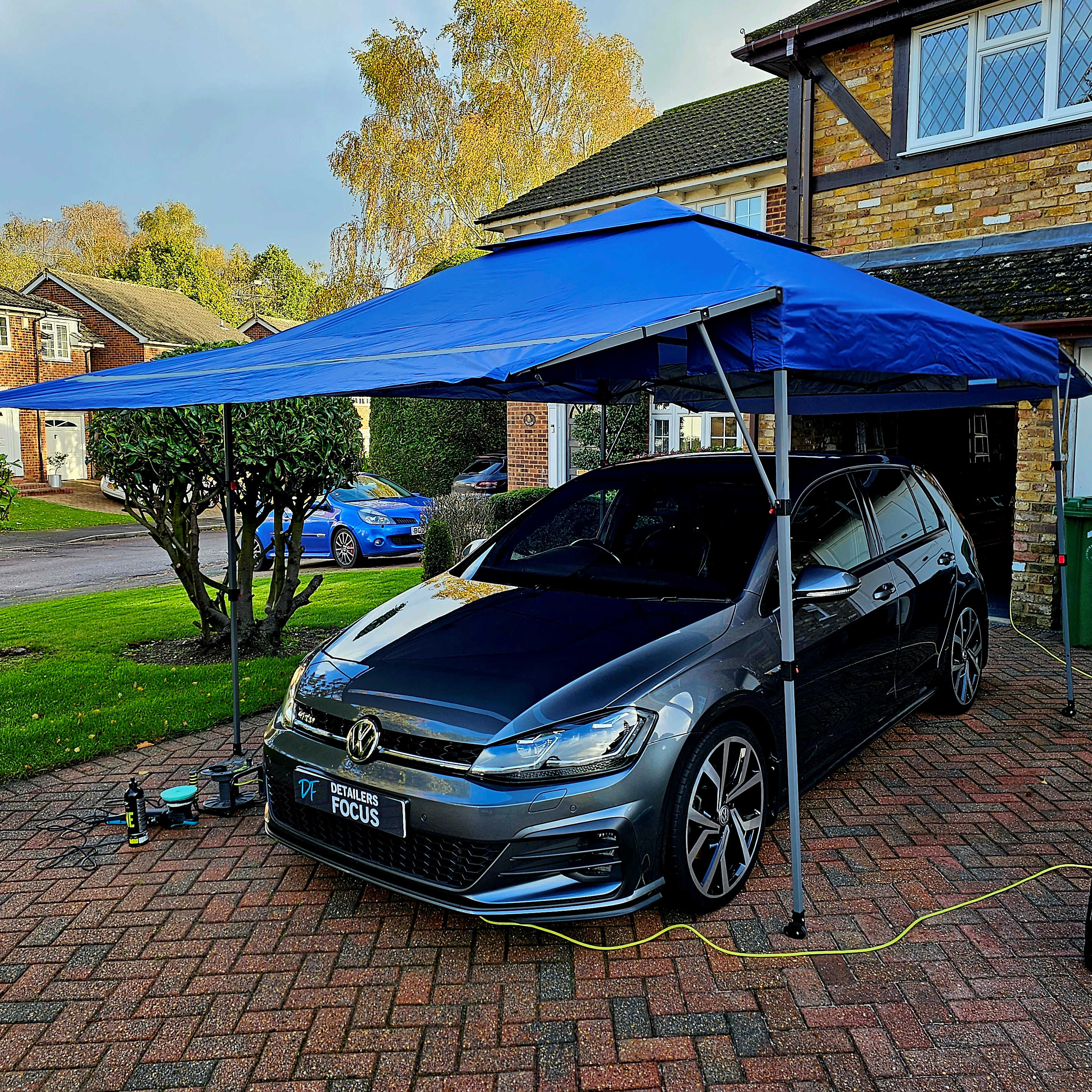 A beautiful grey Golf GTD, under gazebo, undergoing a thorough and professional paint correction and paplication of paint sealant, show glaze and additional layers of paint protection.